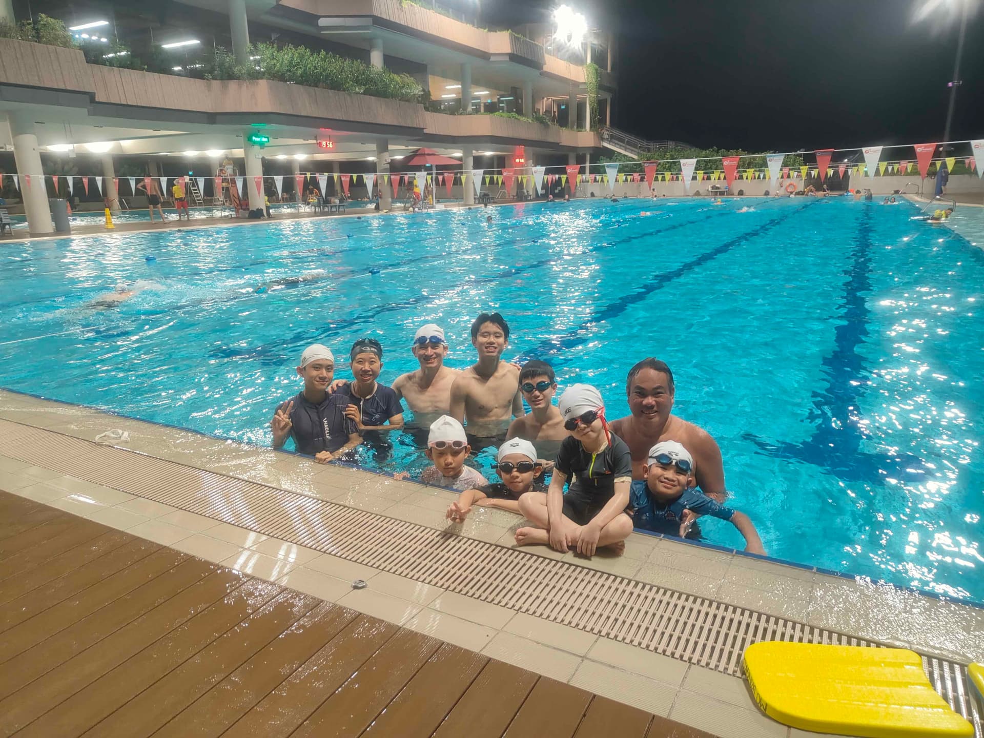 A picture of students with a coach behind all smiling.